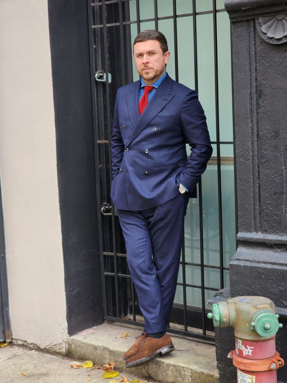 brown shoes with a navy suit