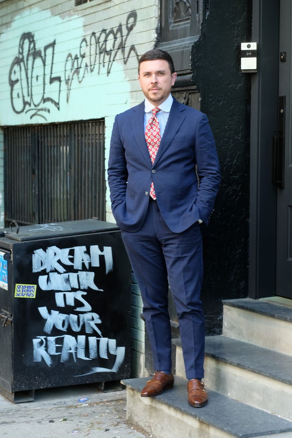 brown shoes with a navy suit