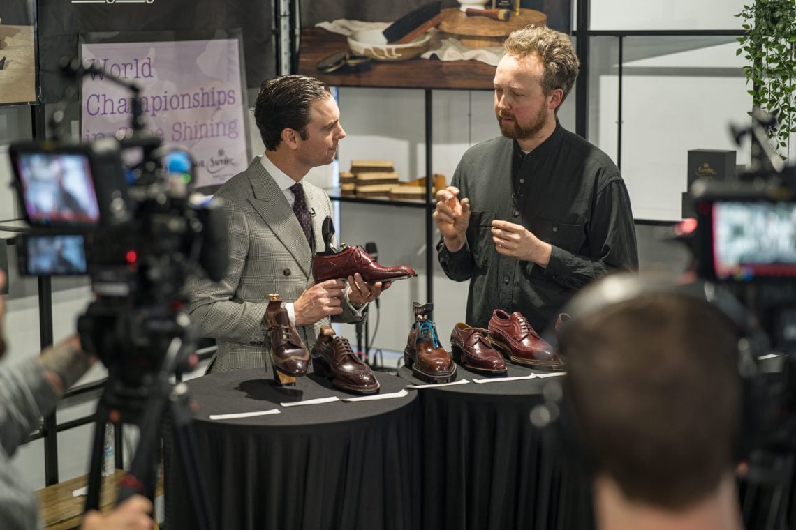 Kirby Allison filming for his YouTube channel, where Daniel Wegan of Catella Shoemaker, part of the jury, went through the strengths of the top placed shoes in the world champs in shoemaking.
