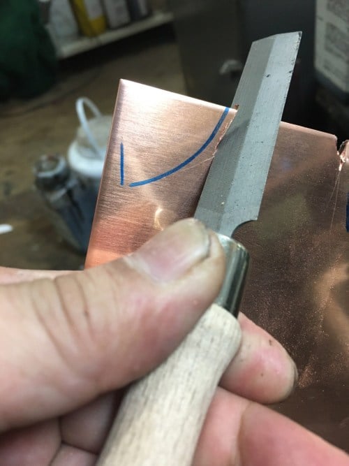 Cutting the heel piece out of soft copper.