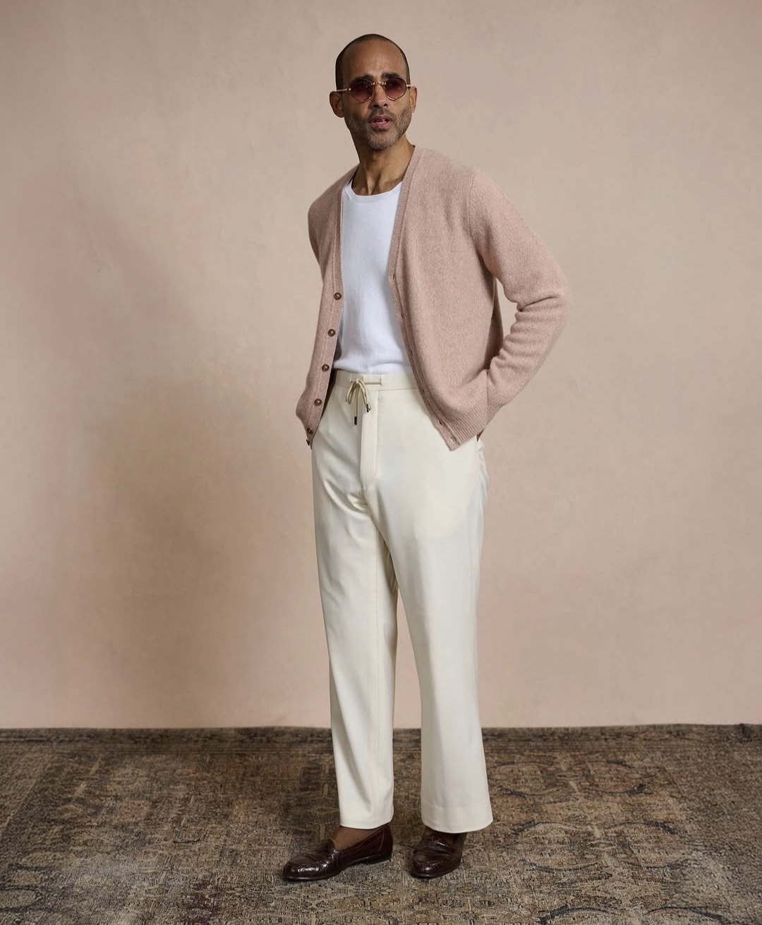 classic style dressing coupled with a casual cardigan and relaxed trousers 