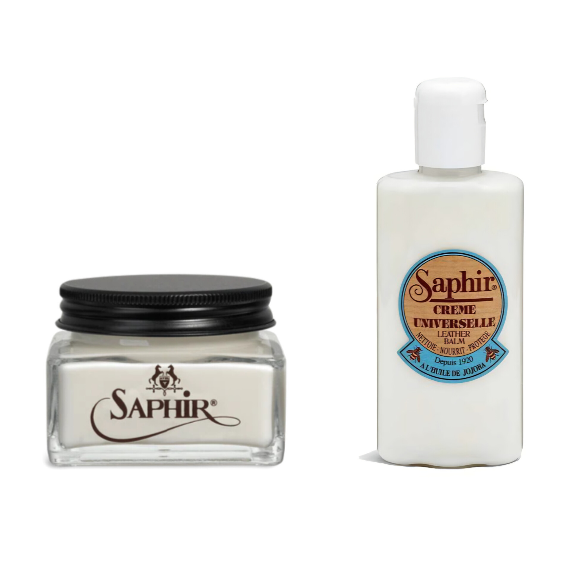 Two Saphir leather care products: a small glass jar of cream with a black lid and a white bottle of leather balm.