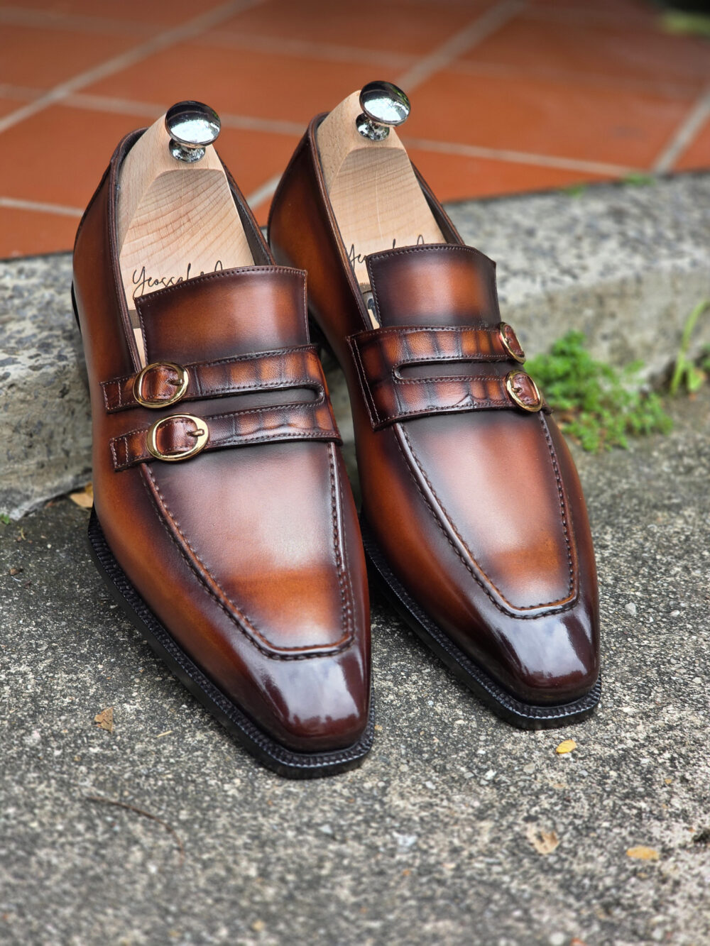 Double strap loafers in brown burnished patina with gold buckles