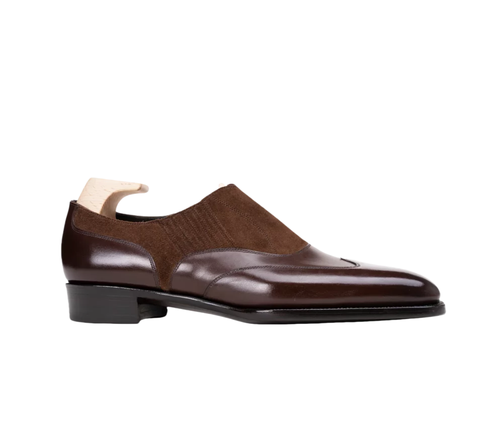 Brown leather and suede dress shoe with a sleek design and a low heel.