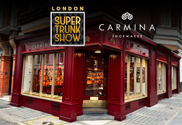A red storefront with large windows displays various shoes, featuring the "Carmina" logo prominently.