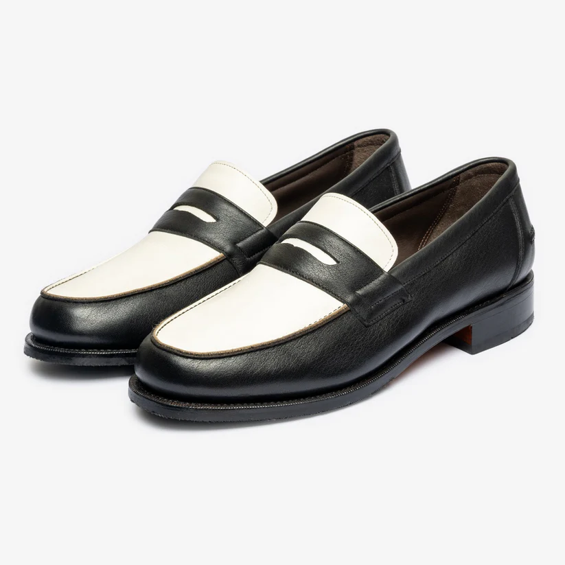 Black and white leather loafers with a decorative strap across the top as part of the Bridlen Spring Promotion