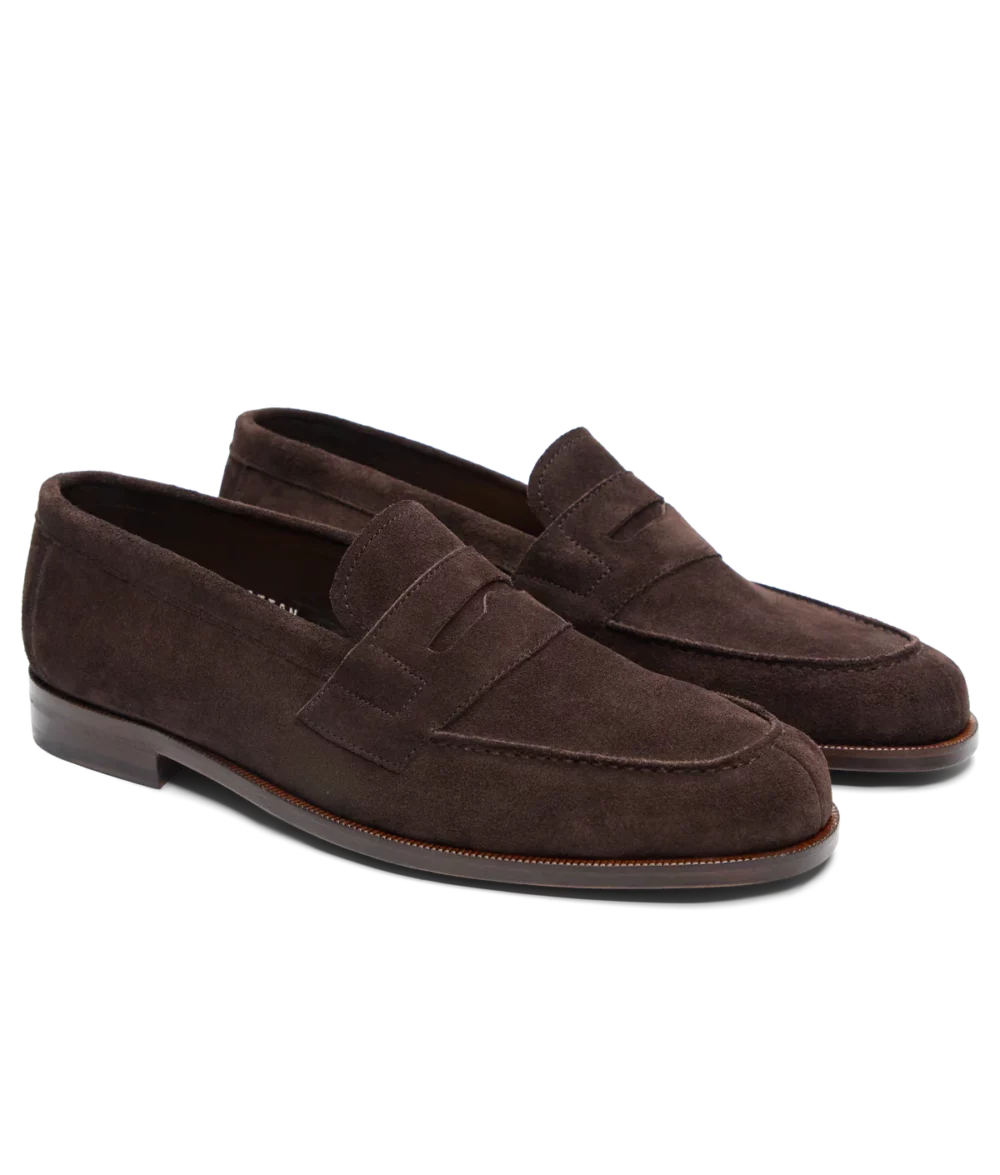 Brown suede loafers with a classic design and subtle stitching details.