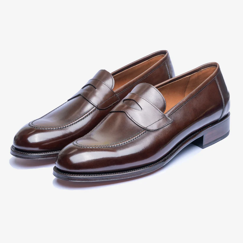 Brown leather loafers with a sleek design and a low stacked heel as part of the Bridlen Spring Promotion