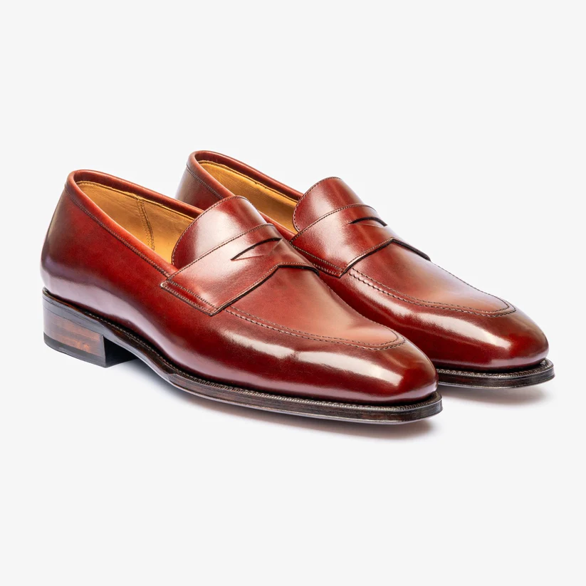 A pair of polished burgundy leather loafers with a low heel and decorative stitching as part of the Bridlen Spring Promotion
