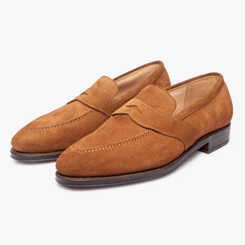 A pair of brown suede loafers with a stitched detail on the upper as part of the Bridlen Spring Promotion