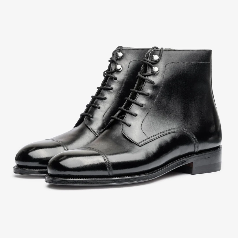Black leather lace-up ankle boots with a polished finish.