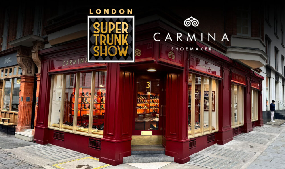 A red storefront with large glass windows displaying shoes, featuring the Carmina Shoemaker logo and the London Super Trunk Show banner.