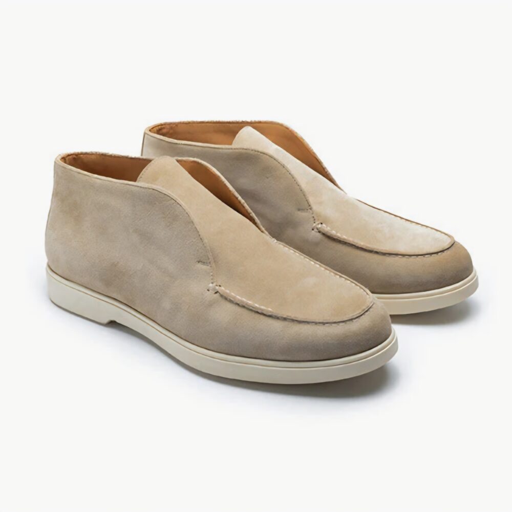 Beige suede slip-on shoes with a cream-colored sole.