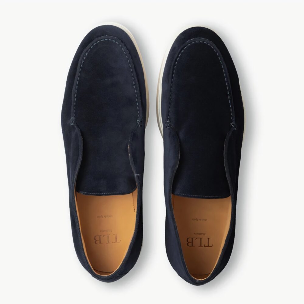 Navy blue suede TLB Mallorca Laceless Ankle Boots with a light-colored sole.