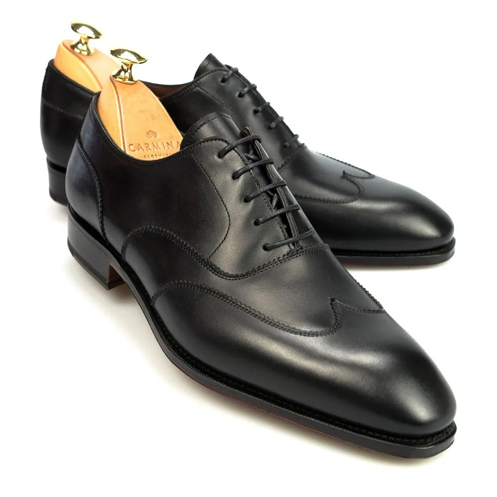 Black leather dress shoes with a polished finish and lace-up design.