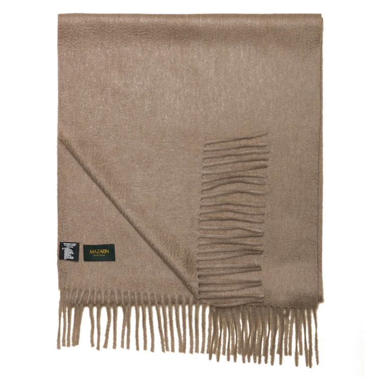 A light brown scarf with fringed edges and a black label.
