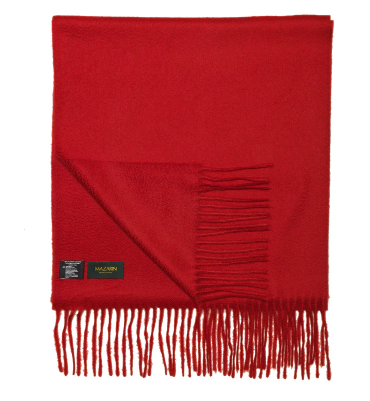 A red scarf with fringed edges and a black label.