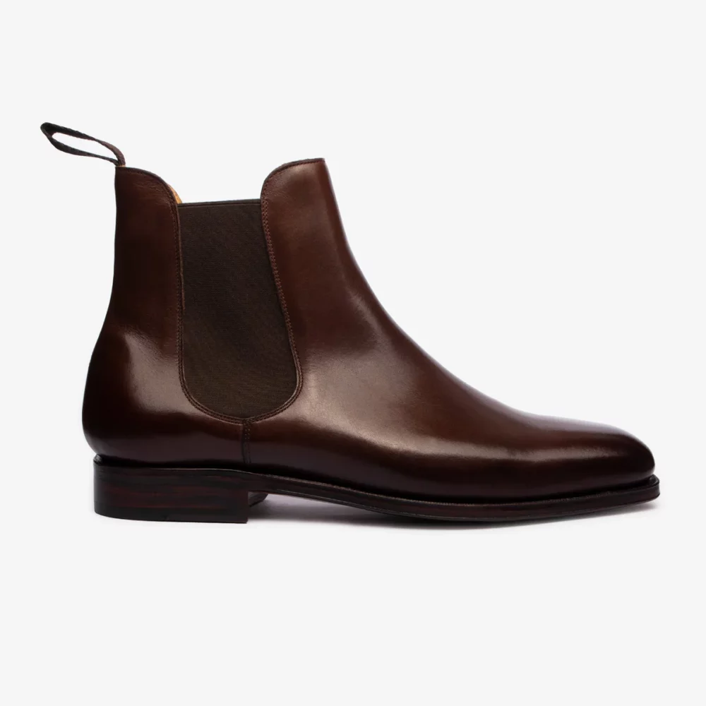 Brown leather Chelsea boot with elastic side panels.