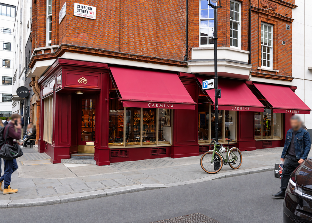 The Carmina London storefront with the name "CARMINA" displayed above large windows showcasing shoes.