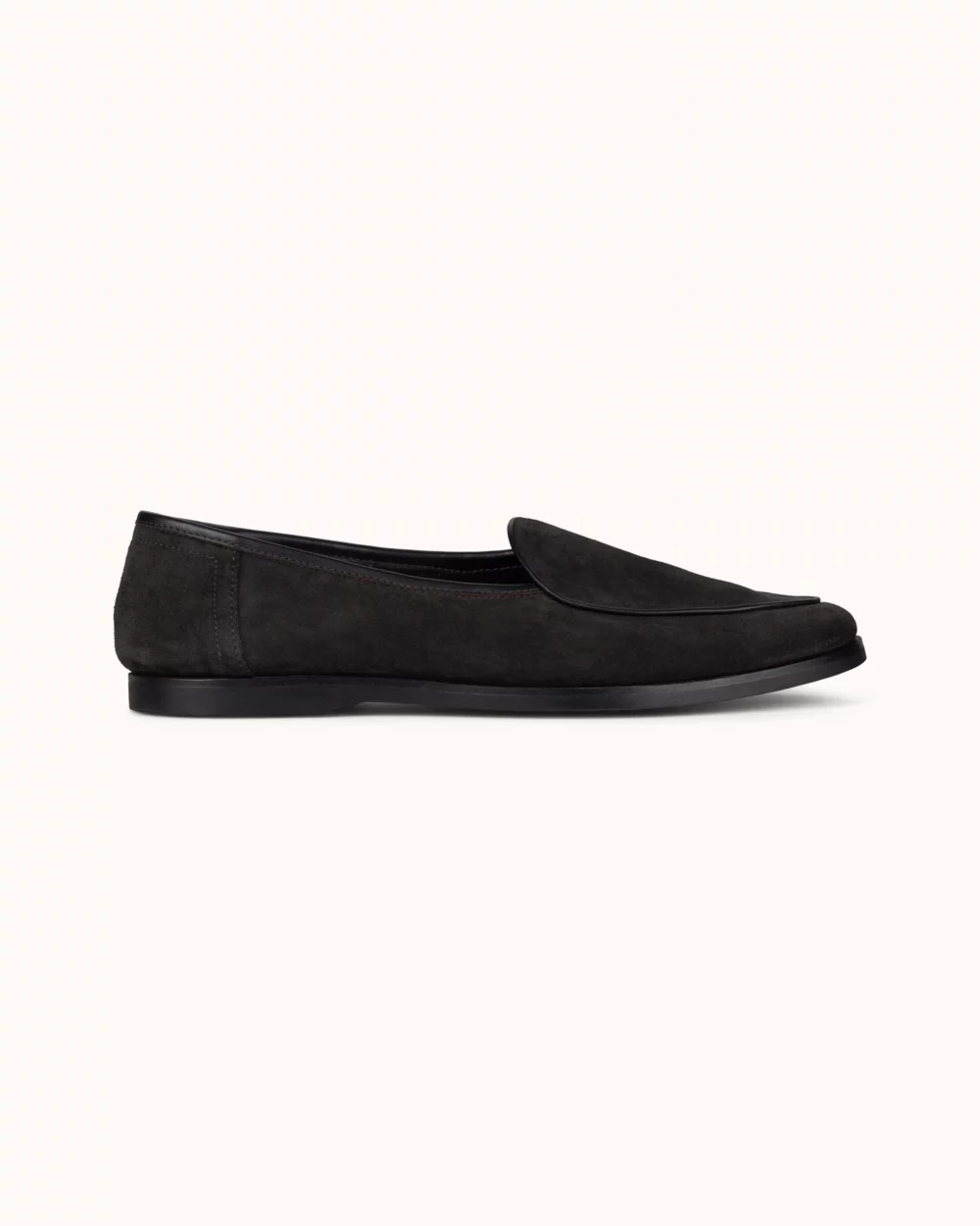 Black suede slip-on shoe with a smooth finish.