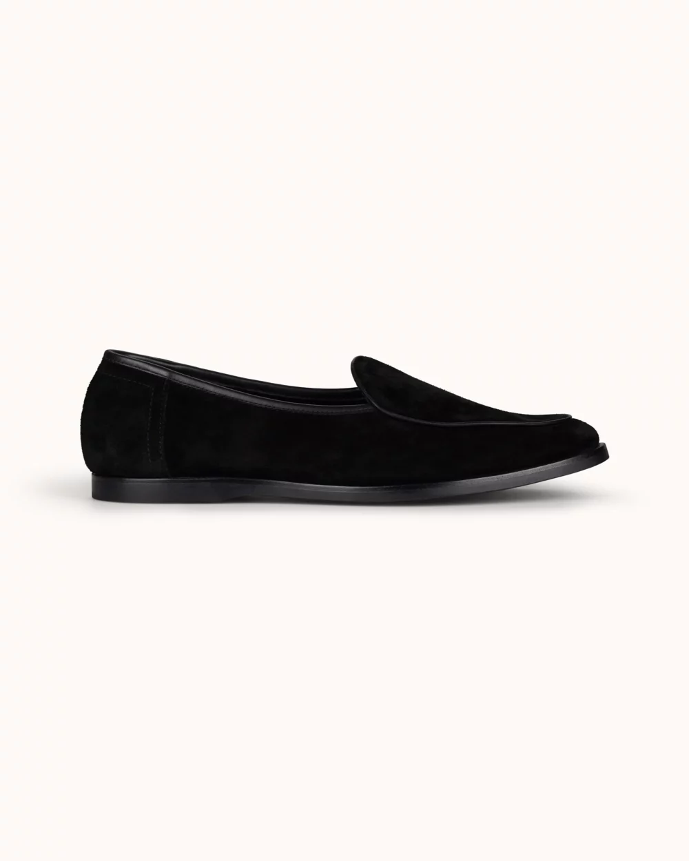 Black suede loafer with a smooth finish and a rounded toe.