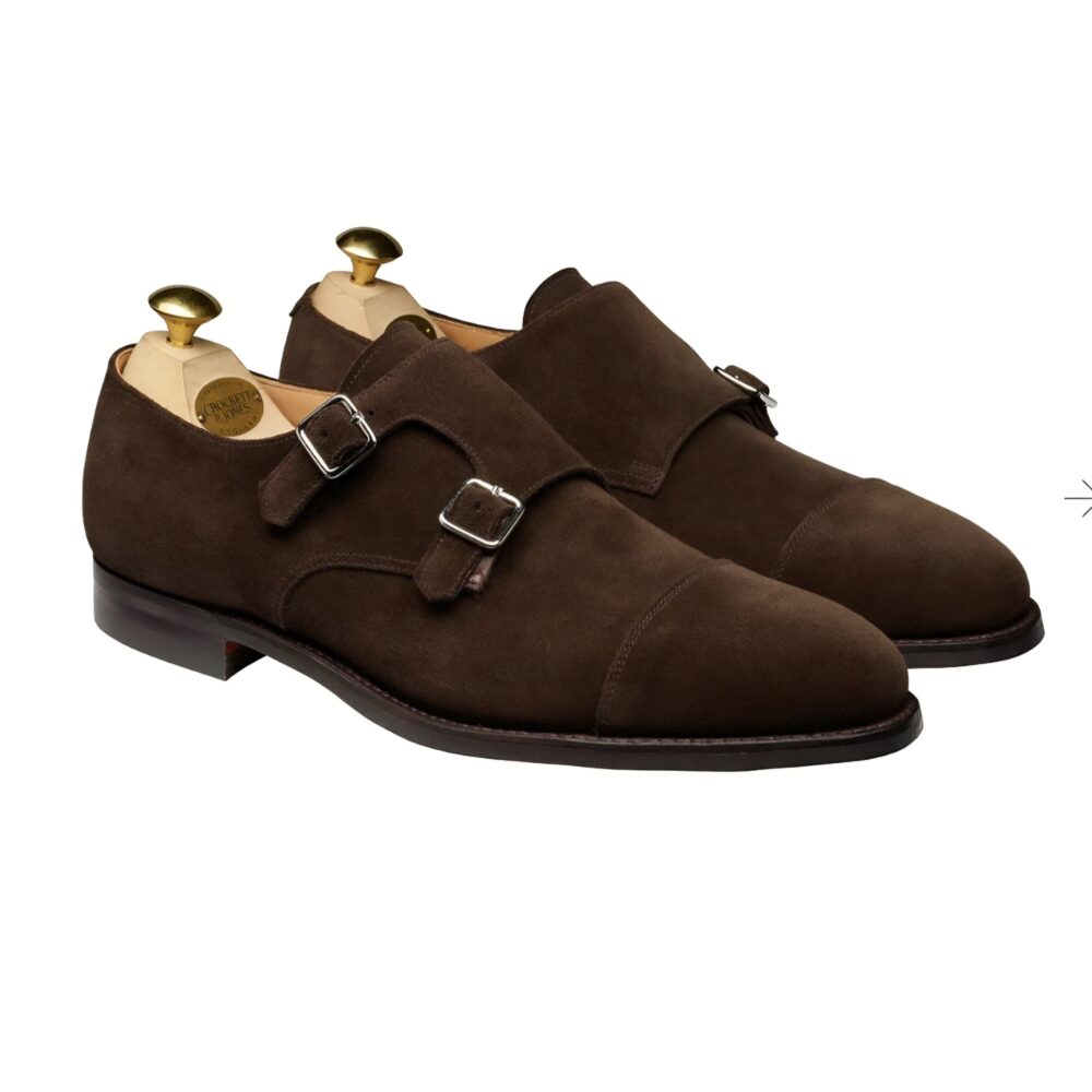 Brown suede double monk strap shoes with silver buckles.