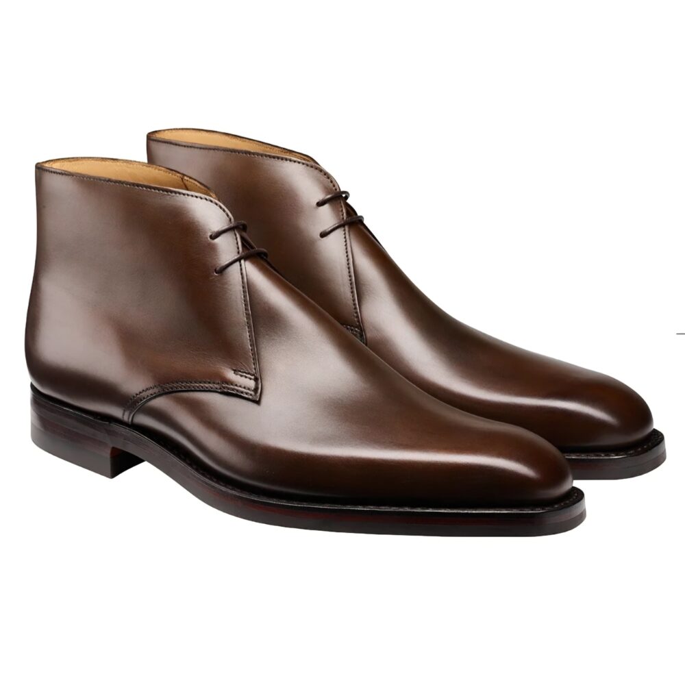 Brown leather ankle boots with a smooth finish and two laces.