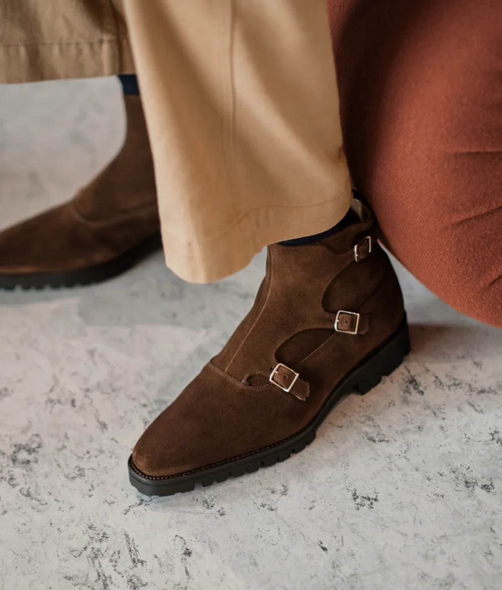 Brown suede ankle boots with buckle details featured in the Septieme Largeur Summer Sale 2026.