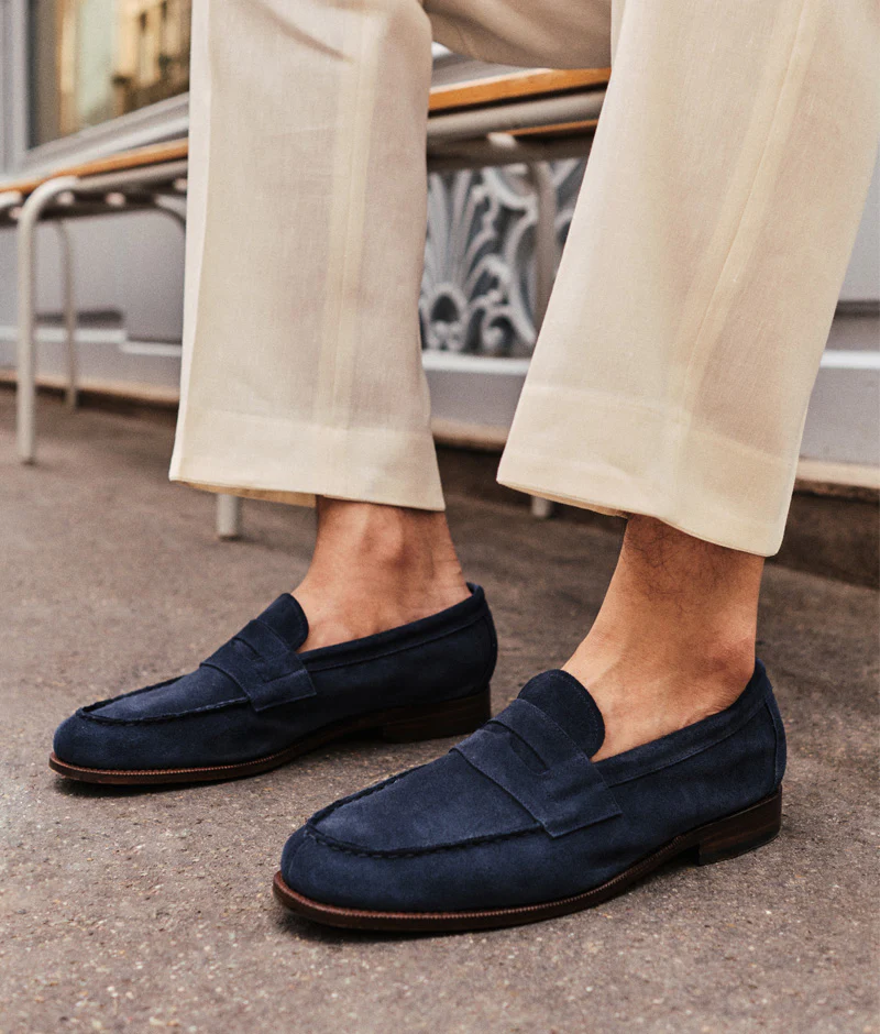 Navy suede loafers are featured prominently, showcasing a stylish design for the Septieme Largeur Summer Sale 2026.