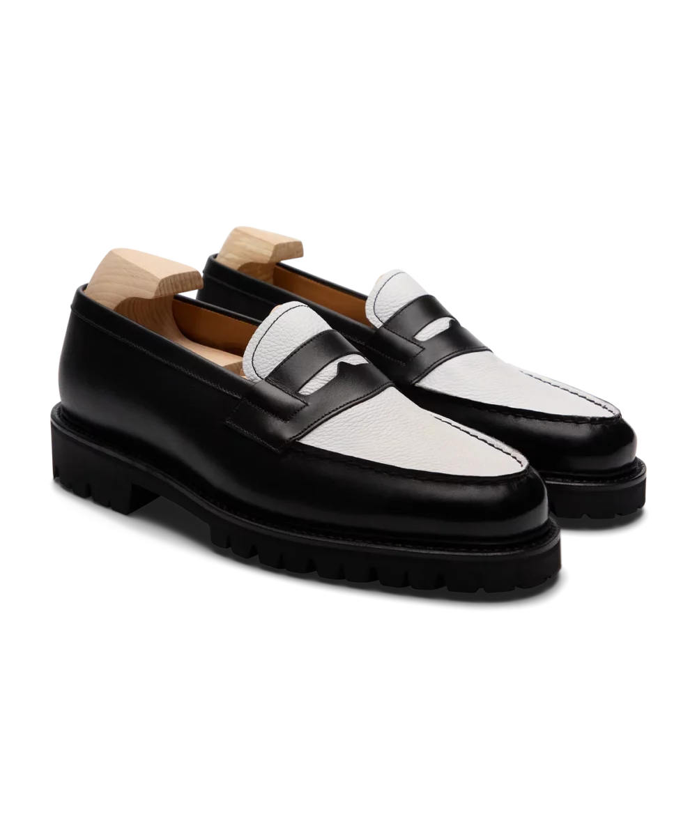Black and white leather loafers featured in the Septieme Largeur Summer Sale 2026.