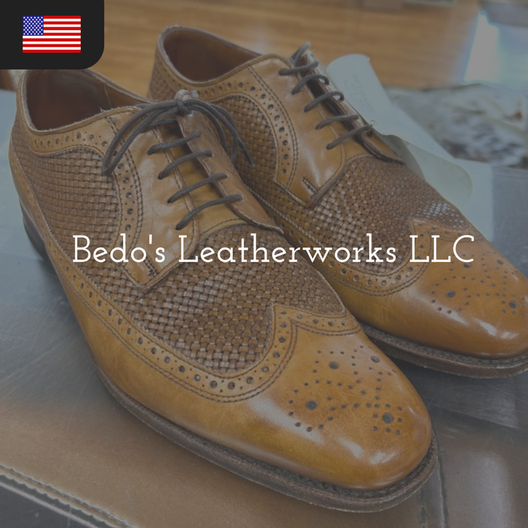 A pair of brown leather dress shoes with woven detailing and brogue accents.