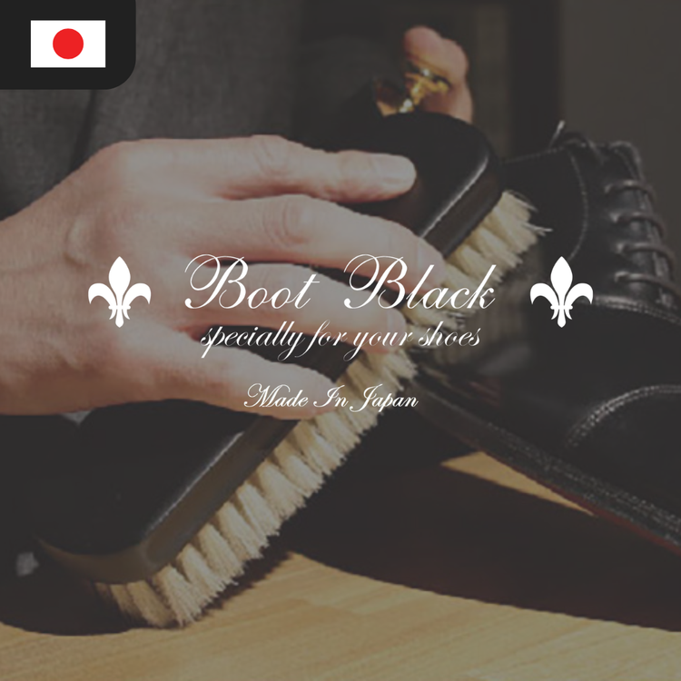 A hand holds a shoe brush over a black shoe, with text reading "Boot Black specially for your shoes Made in Japan."