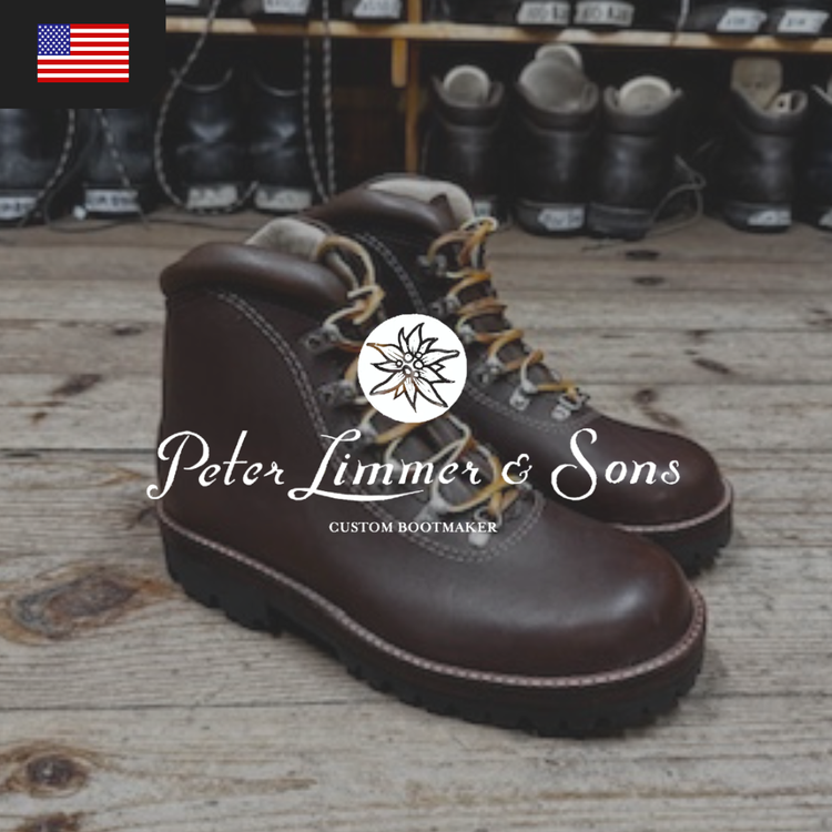 Brown leather boots with yellow laces, labeled "Peter Limmer & Sons, Custom Bootmaker."