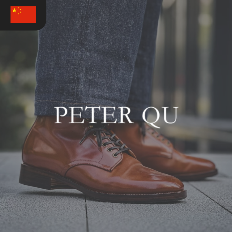 Brown leather boots by Peter Qu, worn with dark jeans.