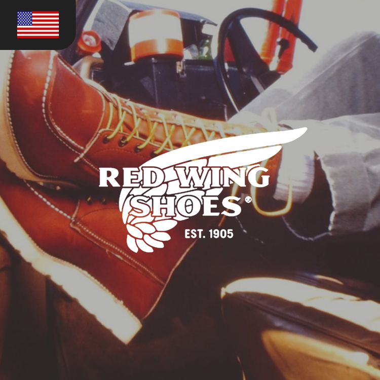 A close-up of brown leather Red Wing boots with yellow laces.