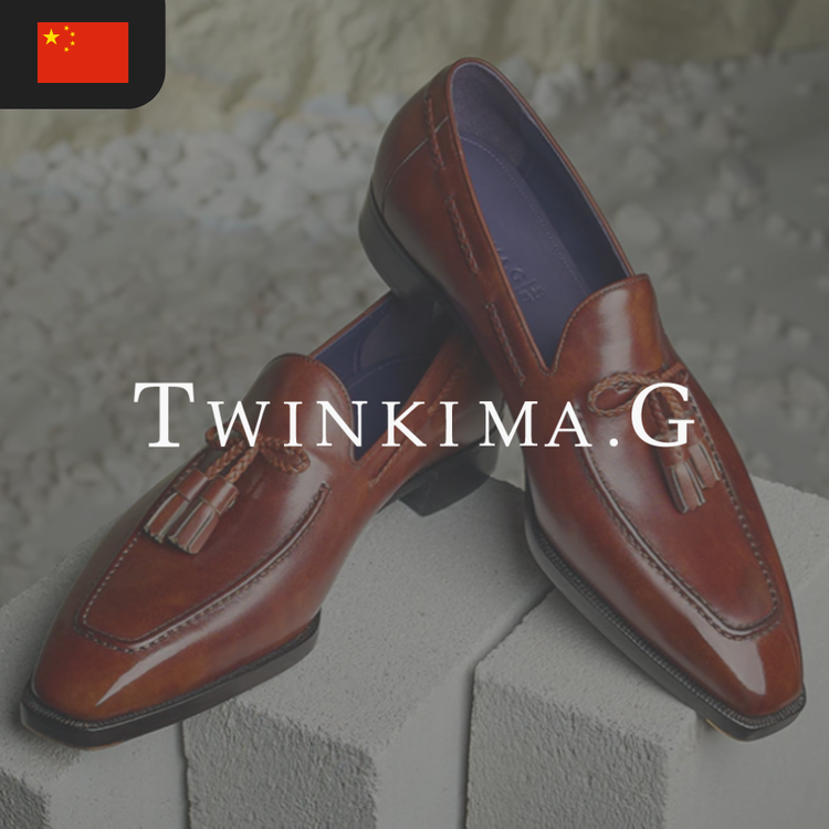 A pair of brown leather loafers with tassels.