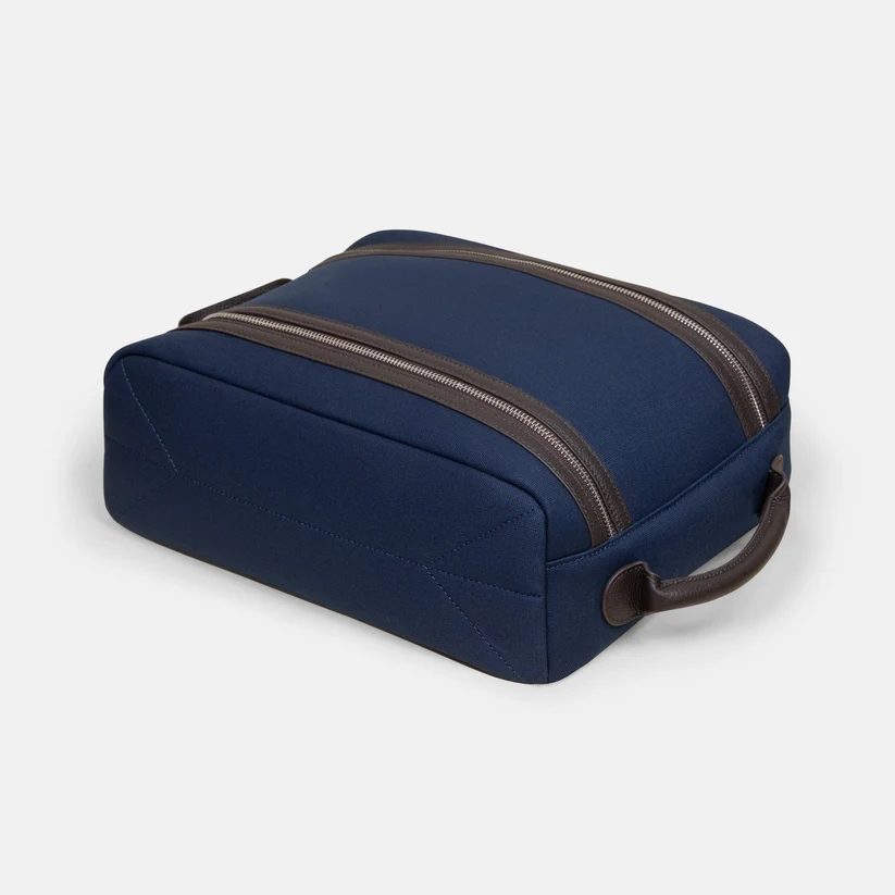 Navy blue Arterton Signature Shoe Bag with brown zippers and a handle.