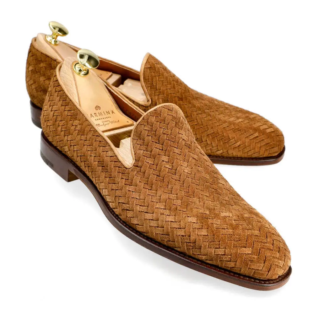 Brown woven suede loafers with a smooth leather sole.