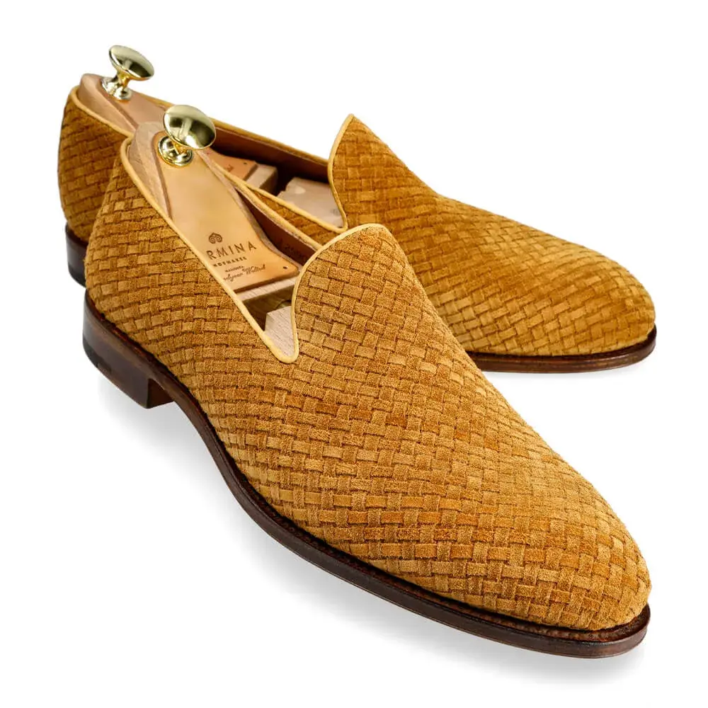 Woven tan suede loafers with wooden shoe trees.