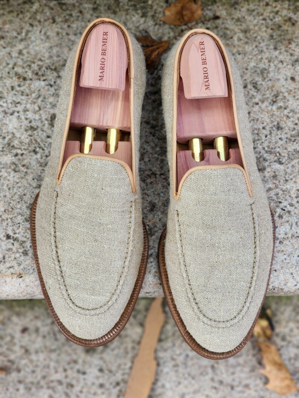 Top view of Mario Bemer canvas loafers in light beige fabric with brown leather soles.