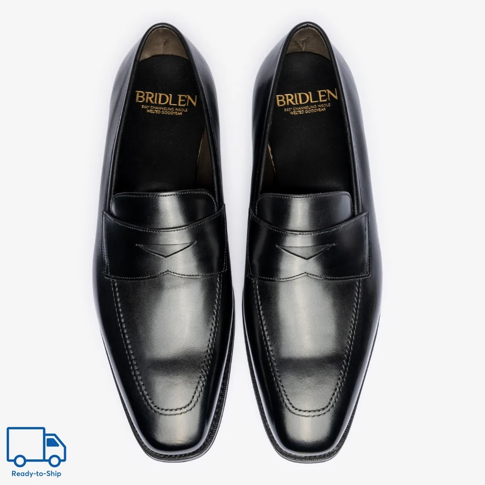 Black leather Bridlen loafers with a sleek design and subtle stitching details.