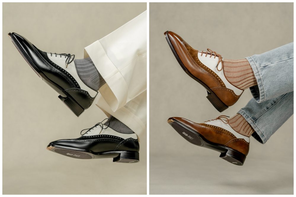 A pair of stylish dress shoes, one black and white and the other brown and white, are shown with coordinating socks.