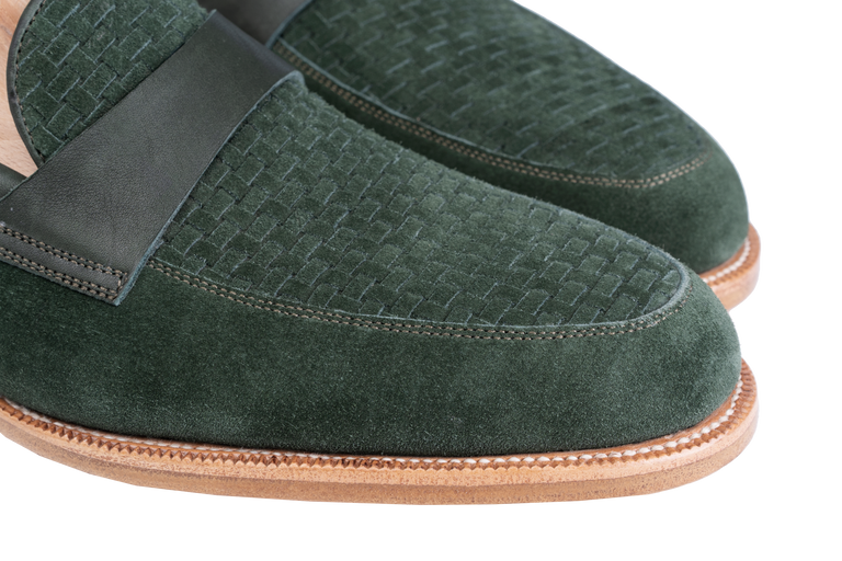 Green suede Amalfi loafers with a woven texture and leather strap.