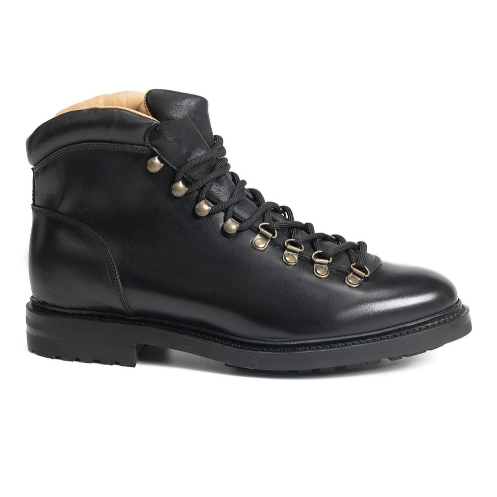 Black leather hiking boot with metal eyelets and laces.
