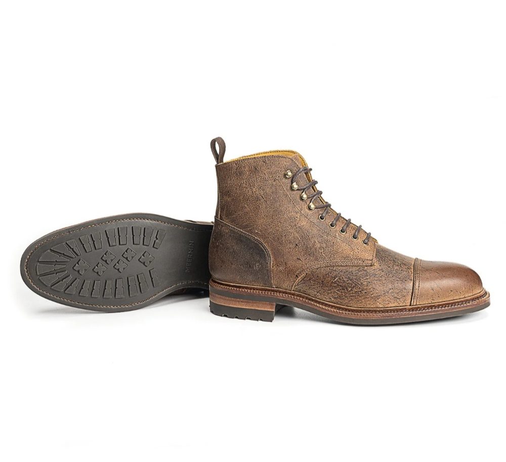 Brown leather ankle boots with a textured finish and a rubber sole.