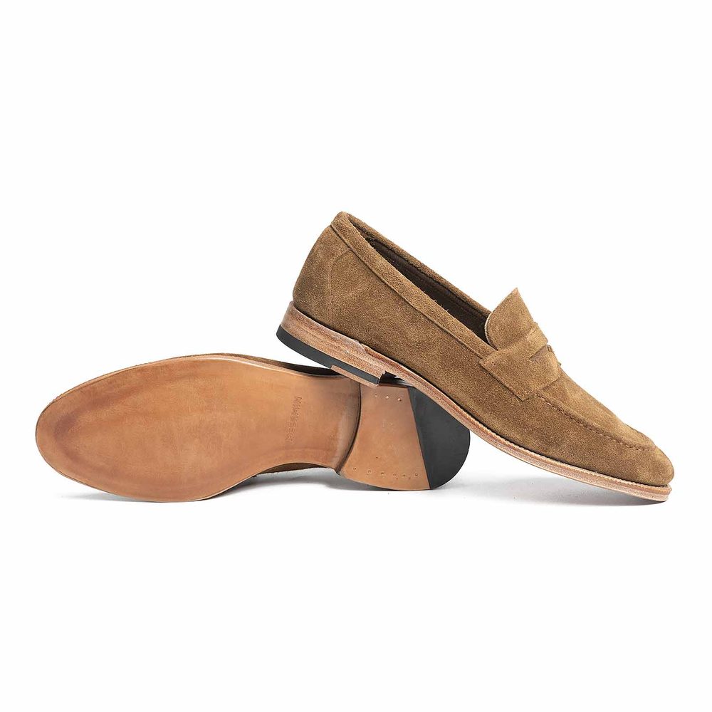 Brown suede loafers with a leather sole.
