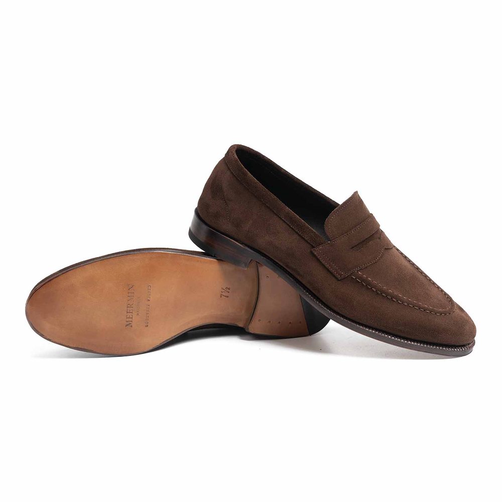 Brown suede loafers with a leather sole, displayed from the side and bottom.
