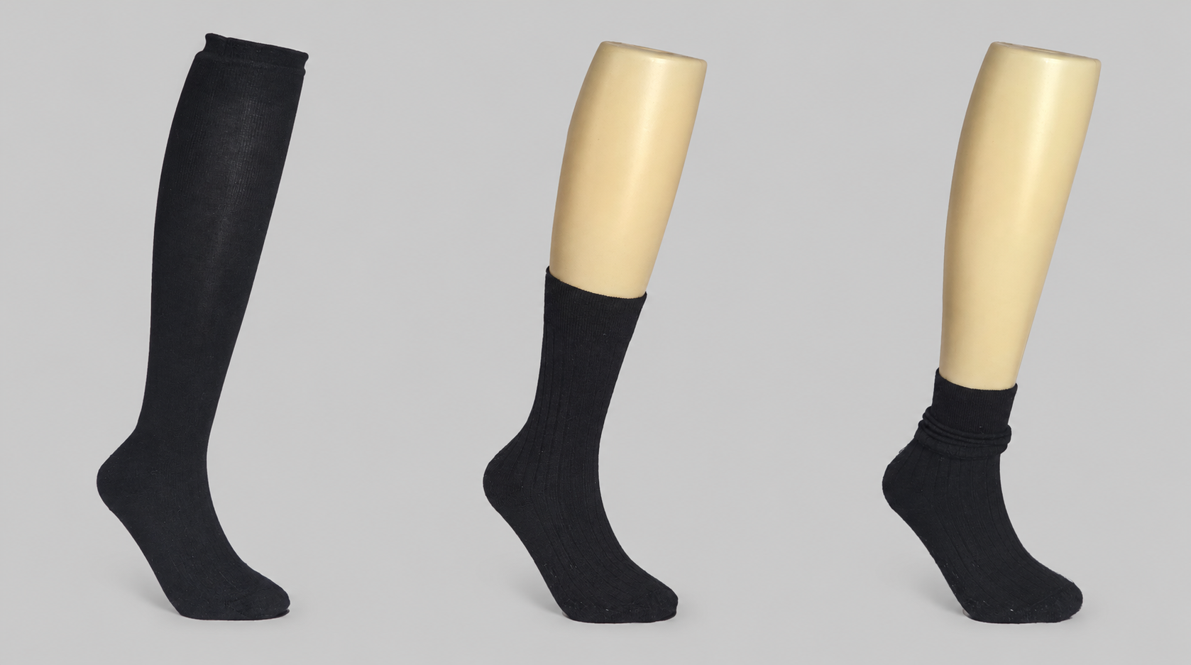 Three pairs of black socks are displayed: one over-the-calf sock, one mid-calf sock, and one ankle sock, highlighting the differences in length.