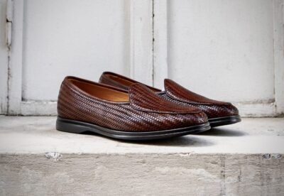 Brown woven loafers with a smooth black sole.